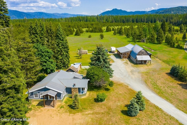 4119 Colburn Culver, Sandpoint, ID 83864 - aerial view of property and surrounding area featuring a heavily wooded area and mountains