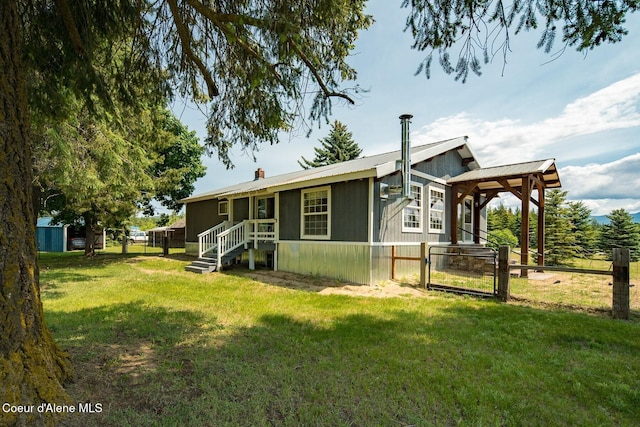 4119 Colburn Culver, Sandpoint, ID 83864 - rear view of property with a gate and a metal roof