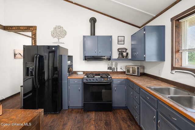 4119 Colburn Culver, Sandpoint, ID 83864 - kitchen featuring black refrigerator with ice dispenser, range with gas cooktop, vaulted ceiling, under cabinet range hood, and blue cabinets