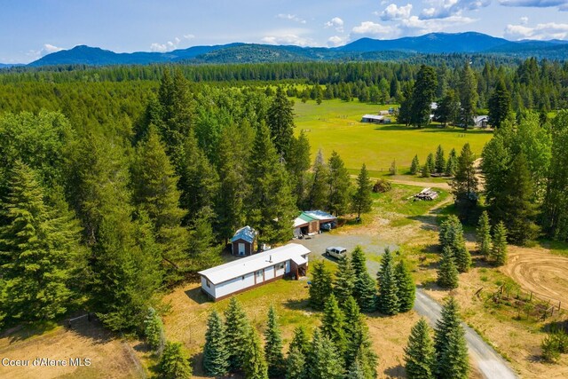4119 Colburn Culver, Sandpoint, ID 83864 - aerial view of property and surrounding area featuring a forest and a mountain backdrop
