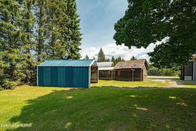 4119 Colburn Culver, Sandpoint, ID 83864 - view of green lawn featuring an outbuilding