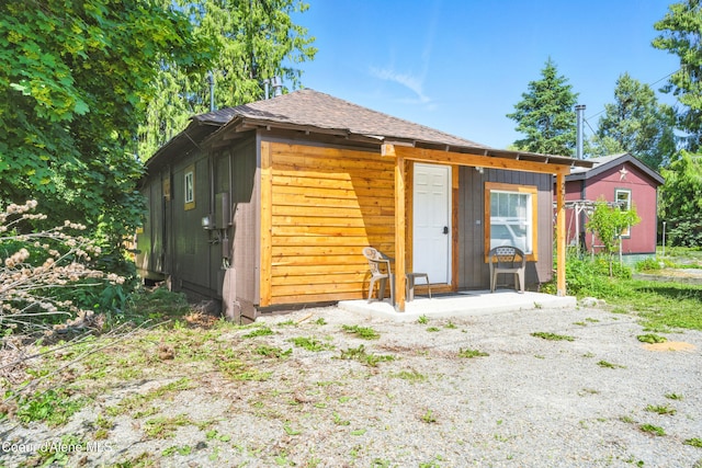 279 Birch Ave, Ponderay, ID 83852 - back of house featuring a shingled roof