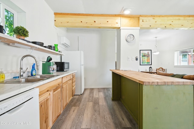 279 Birch Ave, Ponderay, ID 83852 - kitchen with white appliances, butcher block counters, wood finished floors, open shelves, and a center island