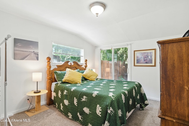 279 Birch Ave, Ponderay, ID 83852 - bedroom featuring carpet flooring, vaulted ceiling, and multiple windows