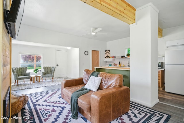 279 Birch Ave, Ponderay, ID 83852 - living area featuring ceiling fan, wood finished floors, and an AC wall unit