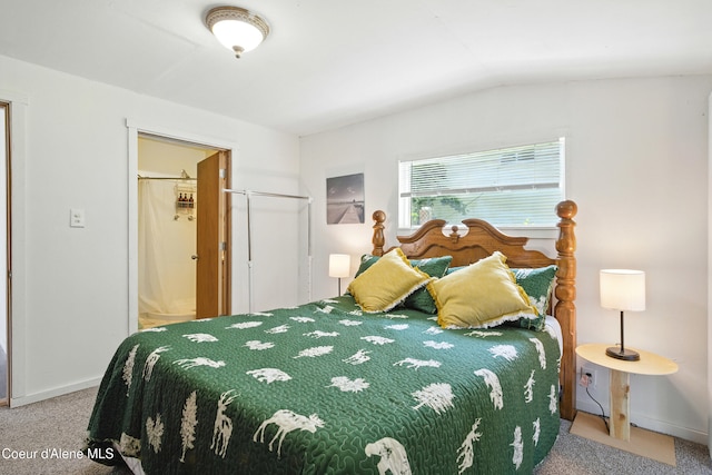 279 Birch Ave, Ponderay, ID 83852 - bedroom with carpet flooring, lofted ceiling, and ensuite bath