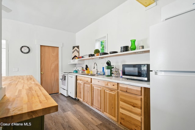 279 Birch Ave, Ponderay, ID 83852 - kitchen with white appliances, open shelves, dark wood-style floors, wooden counters, and an AC wall unit