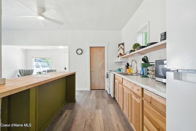 279 Birch Ave, Ponderay, ID 83852 - kitchen with freestanding refrigerator, open shelves, butcher block counters, wood finished floors, and stainless steel microwave