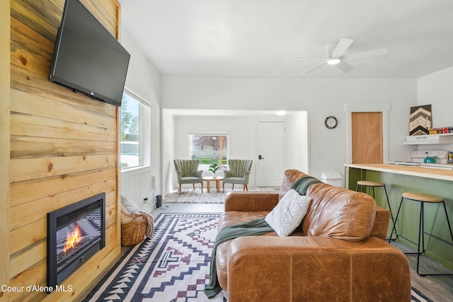 279 Birch Ave, Ponderay, ID 83852 - living area with a glass covered fireplace, wood finished floors, and a ceiling fan