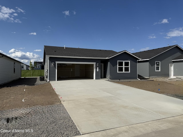 5149 E Rigel Ln, Post Falls, ID 83854 - view of front of property with a garage and concrete driveway