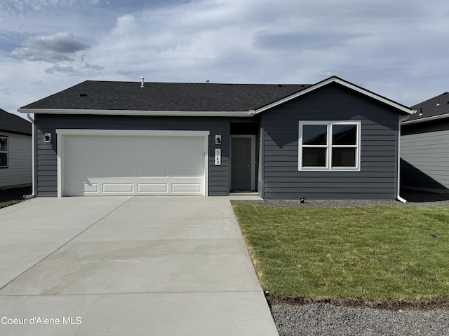 5149 E Rigel Ln, Post Falls, ID 83854 - ranch-style home featuring driveway, an attached garage, a front lawn, and a shingled roof