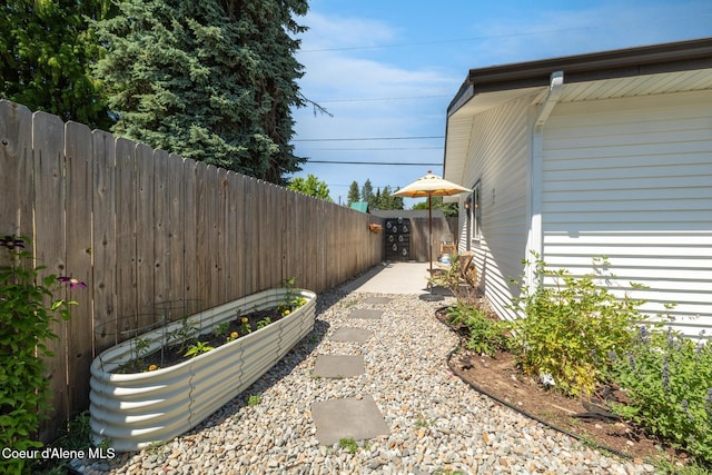 1623 E Boyd Ave, Coeur Dalene, ID 83814 - view of yard with a vegetable garden