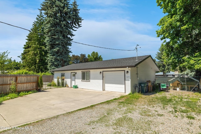 1623 E Boyd Ave, Coeur Dalene, ID 83814 - view of front of house featuring driveway and a garage