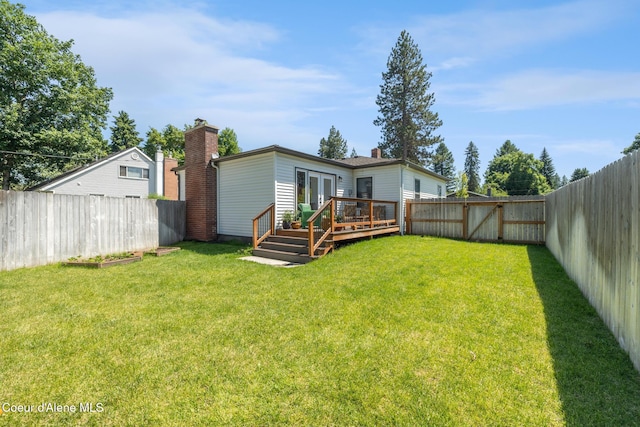 1623 E Boyd Ave, Coeur Dalene, ID 83814 - back of house with a deck, french doors, a fenced backyard, and a chimney