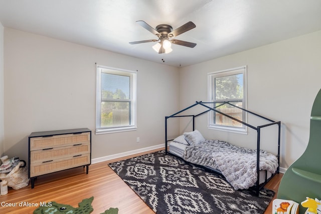 1623 E Boyd Ave, Coeur Dalene, ID 83814 - bedroom with wood finished floors and ceiling fan
