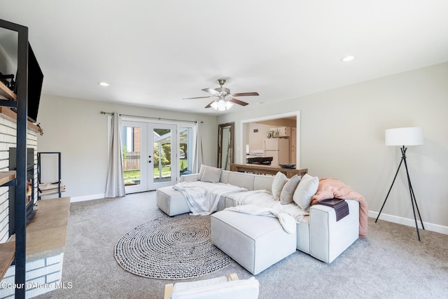 1623 E Boyd Ave, Coeur Dalene, ID 83814 - carpeted living room with french doors, a fireplace, ceiling fan, and recessed lighting