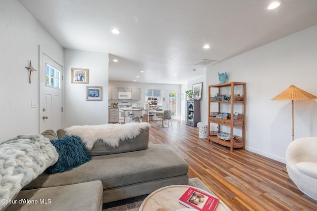 1623 E Boyd Ave, Coeur Dalene, ID 83814 - living room featuring light wood-type flooring and recessed lighting