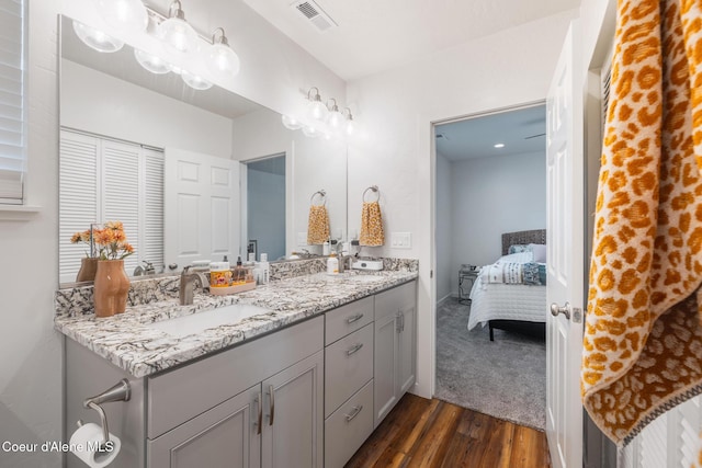 1623 E Boyd Ave, Coeur Dalene, ID 83814 - full bath featuring double vanity, wood finished floors, and ensuite bath