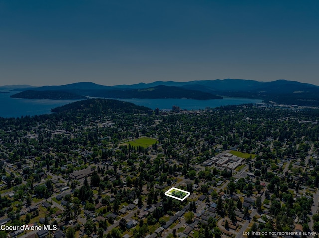 1623 E Boyd Ave, Coeur Dalene, ID 83814 - aerial view of property and surrounding area with a water and mountain view and property boundaries highlighted