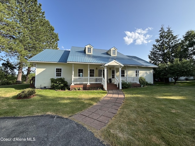 182 Sunnyside Rd, Sandpoint, ID 83864 - view of front of property with a porch, a metal roof, a front lawn, and crawl space