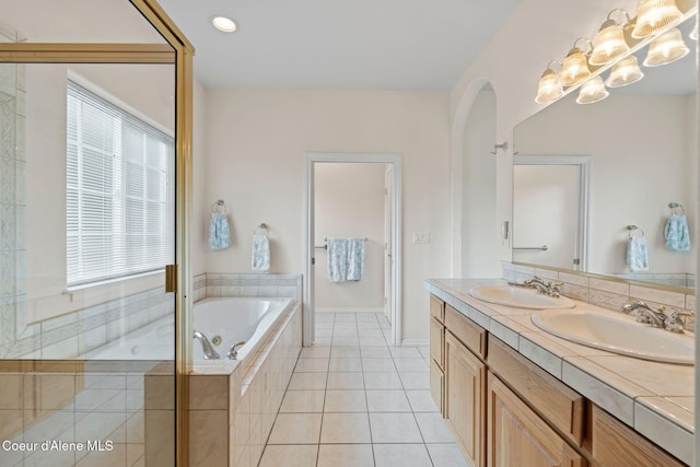 182 Sunnyside Rd, Sandpoint, ID 83864 - bathroom with double vanity, a garden tub, plenty of natural light, and tile patterned floors