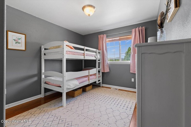 2682 W Iago St, Post Falls, ID 83854 - bedroom featuring baseboards and wood finished floors