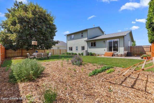 2682 W Iago St, Post Falls, ID 83854 - back of property with entry steps, a fenced backyard, and a patio area