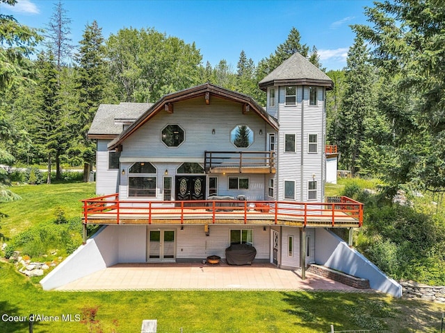 299 Oak Ter, Cocolalla, ID 83813 - back of property featuring a lawn, a patio area, french doors, and a wooden deck