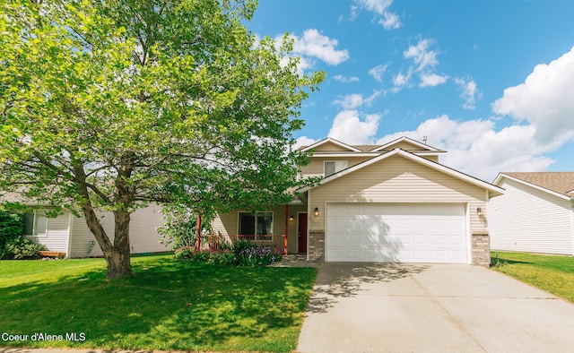 3619 W Manning Loop, Coeur Dalene, ID 83815 - view of front of property featuring driveway, a garage, a front lawn, and covered porch