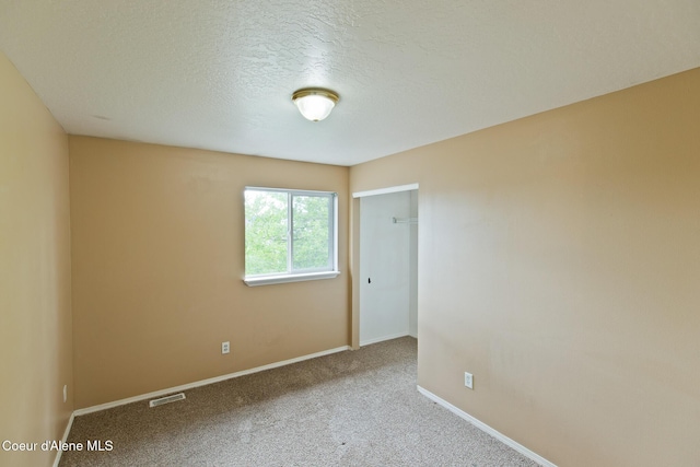 3619 W Manning Loop, Coeur Dalene, ID 83815 - carpeted empty room with baseboards and a textured ceiling