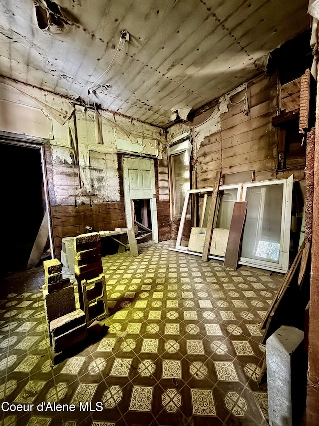 408 High Bank St, Wallace, ID 83873 - miscellaneous room with tile patterned floors and wood walls