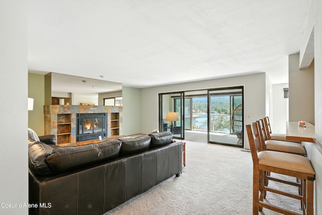 204 E 1st Ave E # 4, Post Falls, ID 83854 - carpeted living room featuring a tiled fireplace