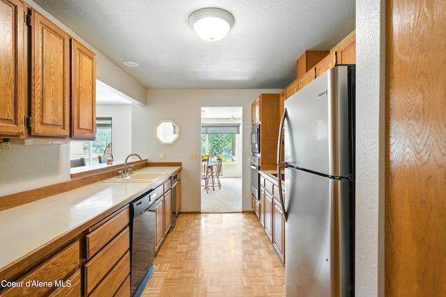 204 E 1st Ave E # 4, Post Falls, ID 83854 - kitchen with appliances with stainless steel finishes, brown cabinets, and light countertops