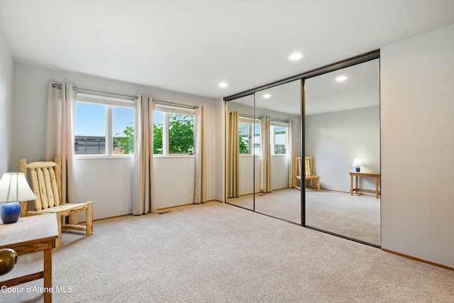 204 E 1st Ave E # 4, Post Falls, ID 83854 - unfurnished bedroom featuring light colored carpet, recessed lighting, and a closet