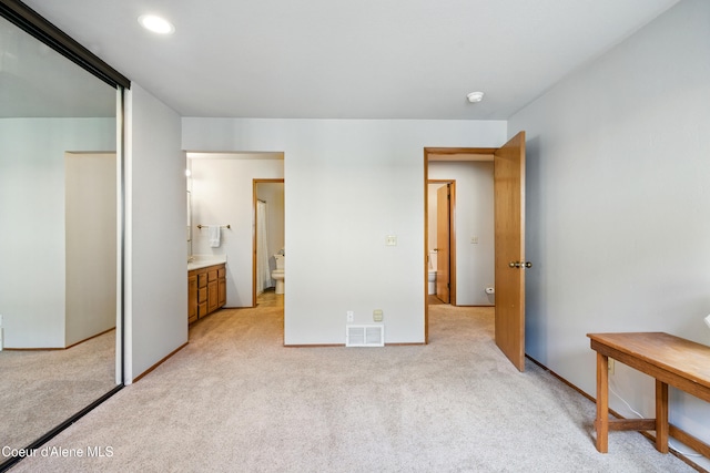 204 E 1st Ave E # 4, Post Falls, ID 83854 - unfurnished bedroom with light colored carpet, recessed lighting, and ensuite bath