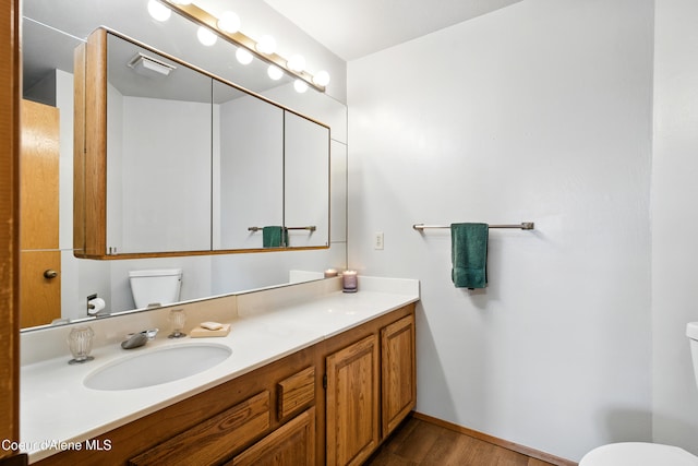 204 E 1st Ave E # 4, Post Falls, ID 83854 - bathroom featuring wood finished floors and vanity