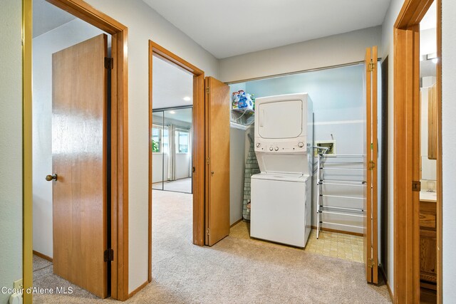 204 E 1st Ave E # 4, Post Falls, ID 83854 - laundry area featuring stacked washing machine and dryer and carpet floors
