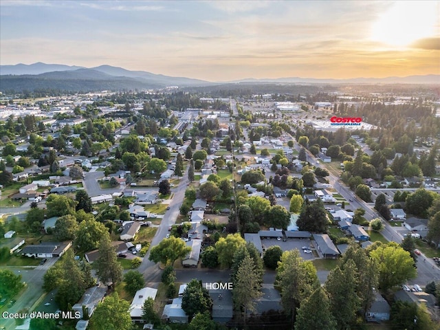 3212 N 7th St, Coeur Dalene, ID 83815 - aerial overview of property's location with a mountain backdrop and nearby suburban area