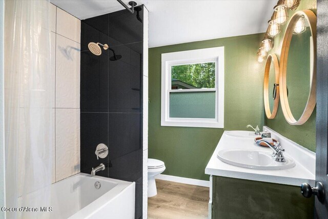 3212 N 7th St, Coeur Dalene, ID 83815 - bathroom with tub / shower combination, double vanity, and wood finished floors