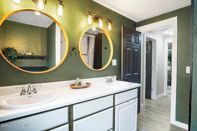 3212 N 7th St, Coeur Dalene, ID 83815 - full bathroom featuring double vanity and wood finished floors