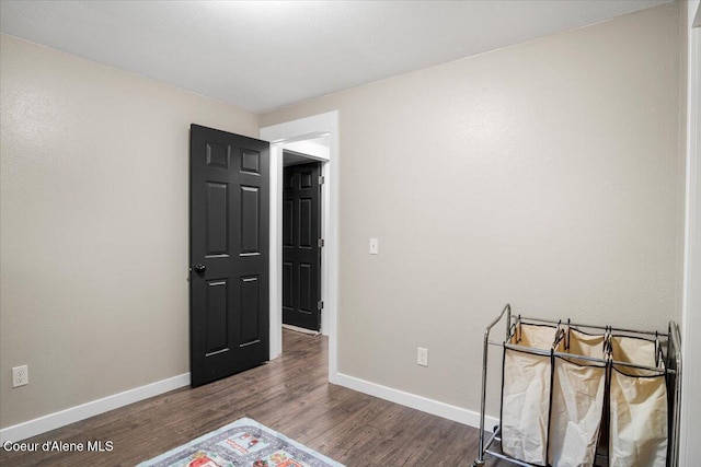 3212 N 7th St, Coeur Dalene, ID 83815 - unfurnished bedroom with wood finished floors and baseboards