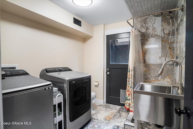 3212 N 7th St, Coeur Dalene, ID 83815 - washroom with washer and dryer and marble finish floors
