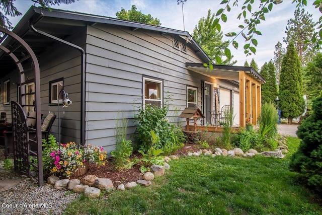 3212 N 7th St, Coeur Dalene, ID 83815 - view of side of home featuring a lawn