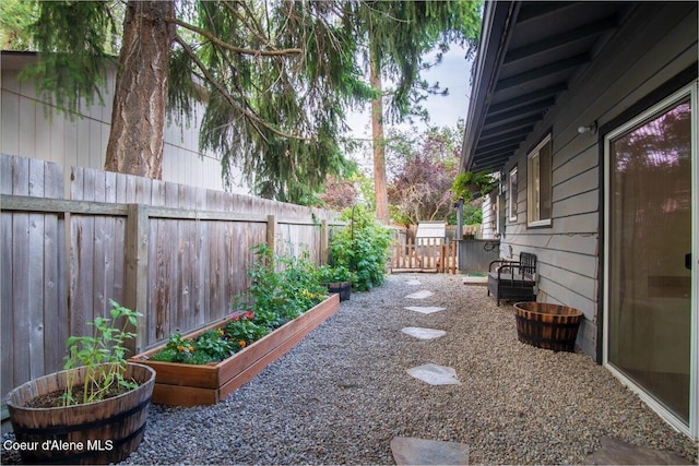 3212 N 7th St, Coeur Dalene, ID 83815 - fenced backyard with a garden