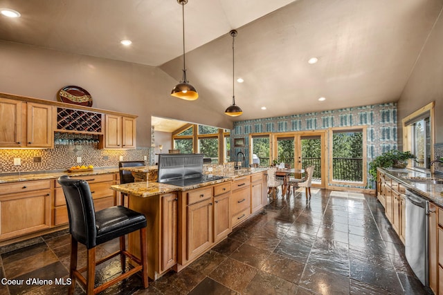 602 Country Club Ln, Pinehurst, ID 83850 - kitchen featuring french doors, vaulted ceiling, stainless steel dishwasher, stone tile floors, and a kitchen island with sink