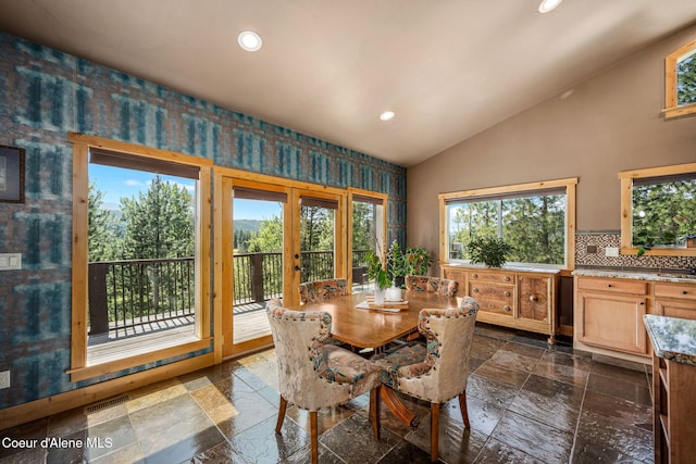 602 Country Club Ln, Pinehurst, ID 83850 - dining area with french doors, recessed lighting, vaulted ceiling, stone tile floors, and wallpapered walls