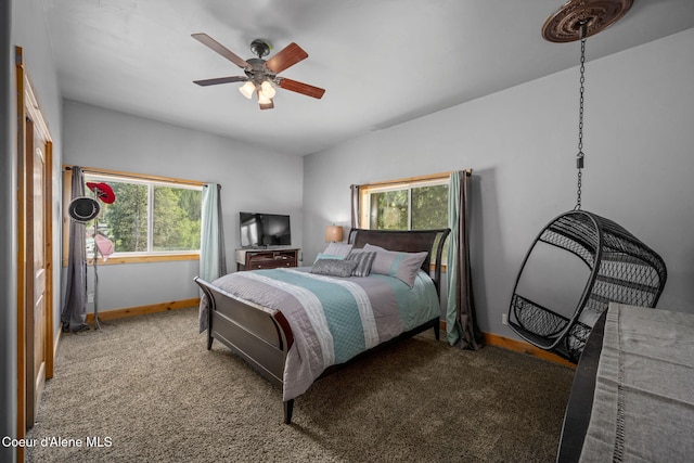 602 Country Club Ln, Pinehurst, ID 83850 - carpeted bedroom featuring multiple windows and a ceiling fan
