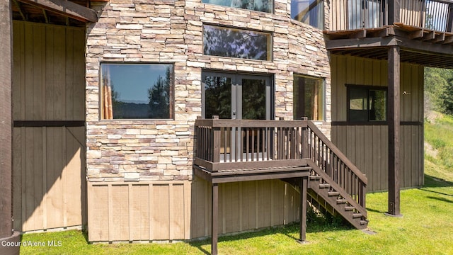 602 Country Club Ln, Pinehurst, ID 83850 - rear view of house with stone siding, a yard, and a deck
