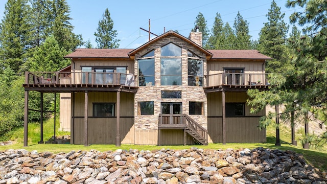 602 Country Club Ln, Pinehurst, ID 83850 - rear view of property with a chimney, stone siding, a wooden deck, and stairway