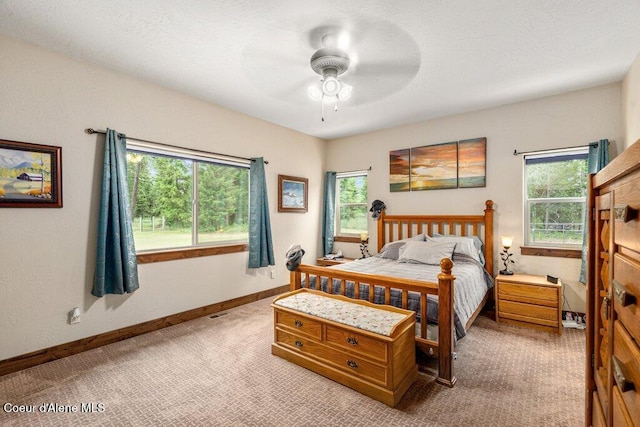 695 W Keva Ln, Athol, ID 83801 - carpeted bedroom featuring multiple windows and ceiling fan
